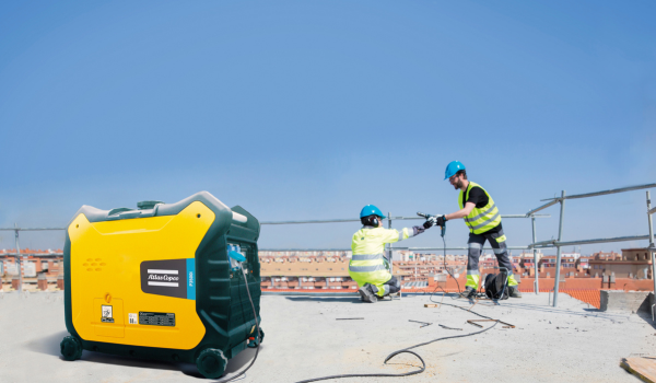 photo of portable air compressor being used on roof